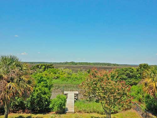 dock on tidal creek marsh grass view